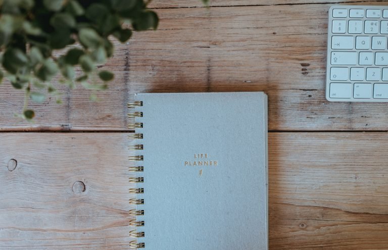 image of a life planner on a wooden table